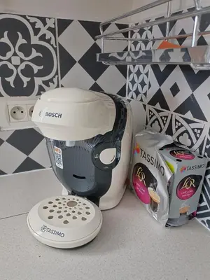 a hair dryer sitting on a counter next to a box at Gîte à la ferme in Sénas