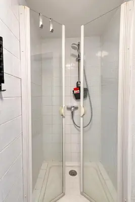 a shower with a glass door in a bathroom at EDEN l Jardin, Bbq, Duplex l Parking Gratuit & Super Wifi l Vue Panoramique Sainte-Victoire in Aix-en-Provence