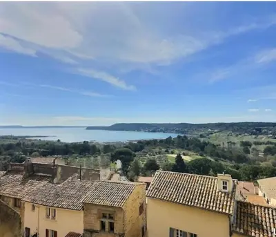 a view of a town with a large body of water at Noceta in Miramas