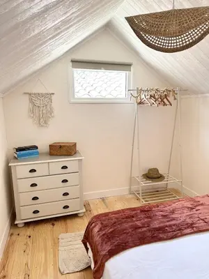 a bedroom with a bed and a window at La maisonnette de Tom in Caumont-sur-Durance