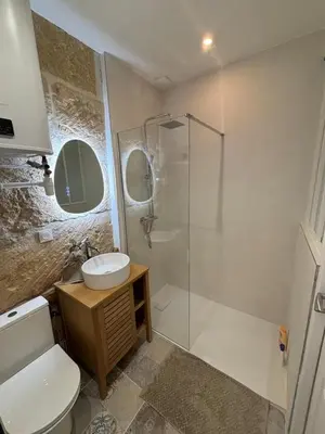 a bathroom with a shower and a toilet and a sink at Studio centre de Charleval in Charleval