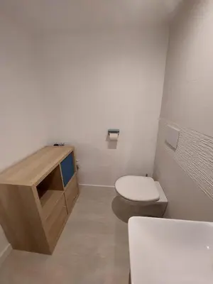 a bathroom with a toilet and a sink at Studio 25m2 in LʼIsle-sur-la-Sorgue
