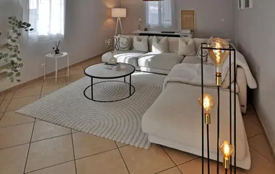 a living room with a white couch and a table at villa in Châteauneuf-de-Gadagne