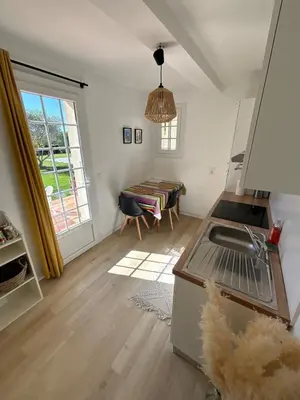 a kitchen with a sink and a table at Studio en Provence avec piscine in La Barben
