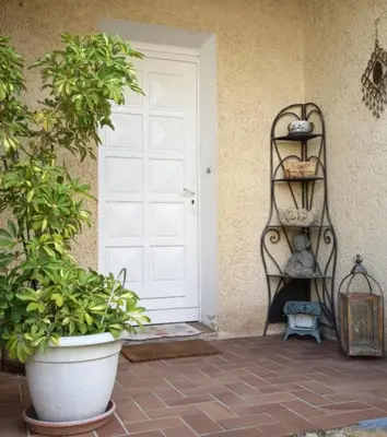 a front door of a house with a plant at fleur de gaïa chambres d'hôtes in Mazan