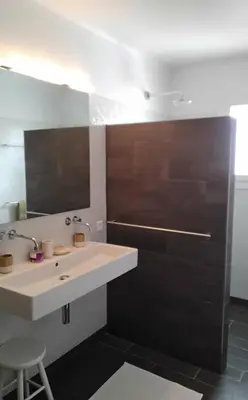 a bathroom with a sink and a mirror at fleur de gaïa chambres d'hôtes in Mazan