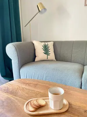 a table with a cup of coffee and a plate of bread at Studio cosy en Provence avec parking Le Monaco in Aix-en-Provence