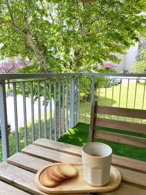 a cup of coffee and a plate of bread on a table at Studio cosy en Provence avec parking Le Monaco in Aix-en-Provence