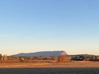 a view of a field with a mountain in the background at MAYA l Studio l Super Wifi & Parking Gratuit l Vue Panoramique Sainte-Victoire in Aix-en-Provence