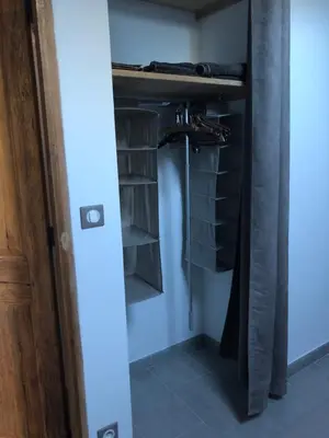 a room with a closet with black shelves at Gîte Les Alpilles in Eygalières