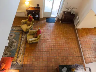 an overhead view of a living room with two couches at Maison Robert in La Tour-dʼAigues