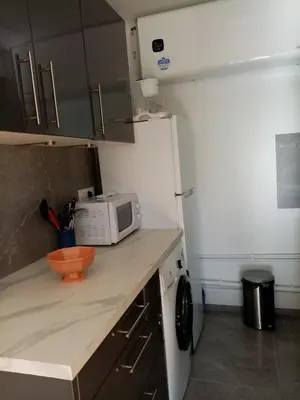 a kitchen with a counter top with a microwave at Aix centre charmant T2 climatisé parc jourdan in Aix-en-Provence