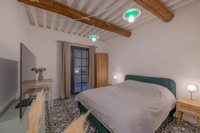 a bedroom with a white bed and a window at Appartement Belle Lettre 2 in Aix-en-Provence