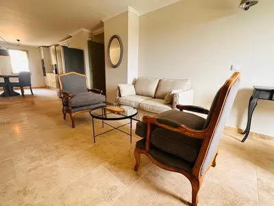 a living room with a couch and chairs and a table at La Réserve Provence in Vaugines