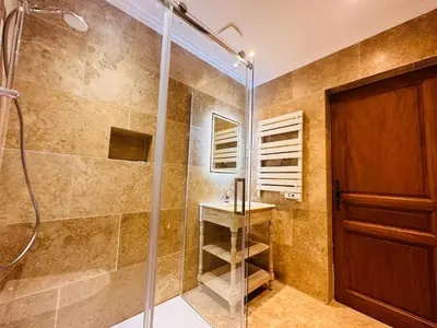 a bathroom with a shower and a sink at La Réserve Provence in Vaugines