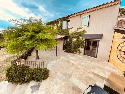 a house with a tree in front of it at La Réserve Provence in Vaugines