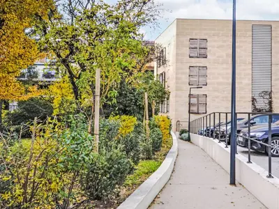 a sidewalk in front of a building with cars at Apartment Pigonnet by Interhome in Aix-en-Provence