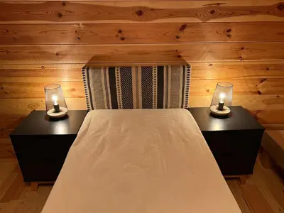 a bedroom with two beds with lights on them at villa spacieuse piscine jacuzzi 8 chambres 16 couchages in Saint-Chamas