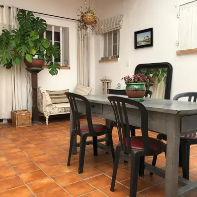 a dining room with a table and chairs at villa spacieuse piscine jacuzzi 8 chambres 16 couchages in Saint-Chamas