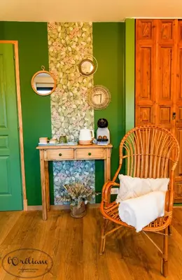 a room with a wooden table and a chair at CHAMBRES D'HÔTES L'Oréliane en Provence Adults Only in Châteauneuf-de-Gadagne