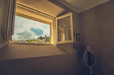 a window in a bathroom with a view of a city at CHAMBRES D'HÔTES L'Oréliane en Provence Adults Only in Châteauneuf-de-Gadagne