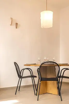 a table with two chairs and a table with wine glasses at Charme et Modernité au coeur d'Aix & Cours Mirabeau in Aix-en-Provence