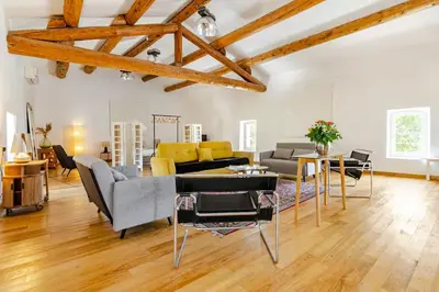 a living room with a couch and a table at Gite dans un Mas Provençal avec Jacuzzi in Oppède