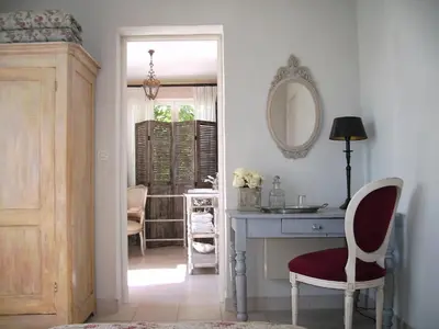 a room with a desk and a mirror at 