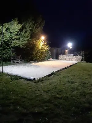 a walkway at night with lights in a park at Le pavé in Gordes