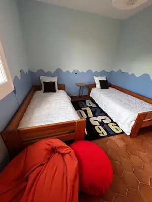 a bedroom with two beds and a redomaly at Le Paradis au centre du Vaucluse in Saumane-de-Vaucluse