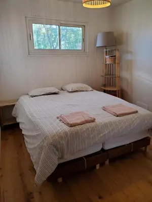 a bedroom with a bed with two towels on it at Charming Famillial House with pedestrian access to Village in Venelles