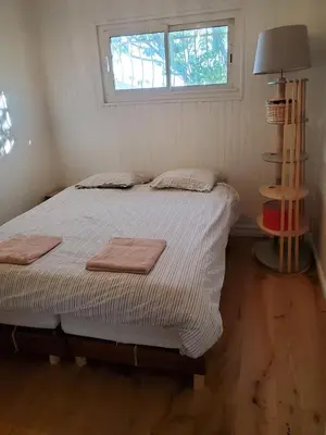 a bedroom with a bed with two towels on it at Charming Famillial House with pedestrian access to Village in Venelles