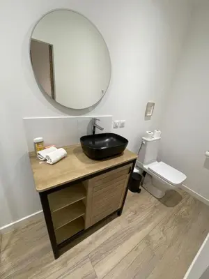a bathroom with a black sink and a mirror at Appartement centre Aix Terrace et ascenseur in Aix-en-Provence