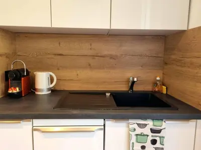 a kitchen with a sink and a counter top at Bright T2 - parking - AC in Aix-en-Provence