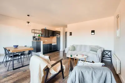 a living room with a couch and a table at Les Coteaux de Pont Royal en Provence - maeva Home - Appartement climatisé 3 pièces 6 personnes - Prestige MAE-6331 in Mallemort