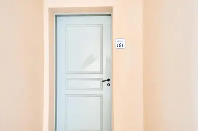 a white door with a sign on it at Les Coteaux de Pont Royal en Provence - maeva Home - Appartement climatisé 3 pièces 6 personnes - Prestige MAE-6331 in Mallemort