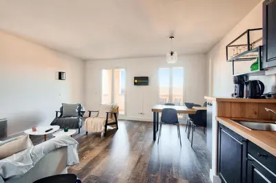 a kitchen and living room with a table and chairs at Les Coteaux de Pont Royal en Provence - maeva Home - Appartement climatisé 3 pièces 6 personnes - Prestige MAE-6331 in Mallemort