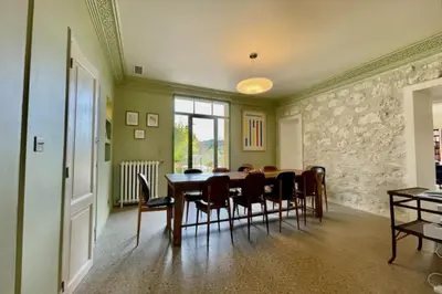 a dining room with a table and chairs at Magnificent Bourgeois House Renovated with Elegance and Art Deco Style in Le Thor