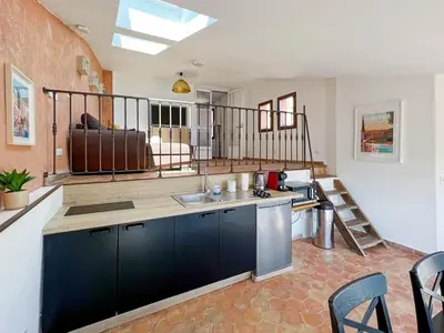 a kitchen with a sink and a counter top at Duplex centre de Roussillon avec Climatisation et vue in Roussillon