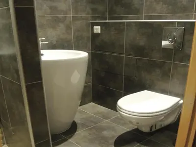 a bathroom with a toilet and a sink at Holiday Home in L'Isle-sur-la-Sorgue with Pool in LʼIsle-sur-la-Sorgue