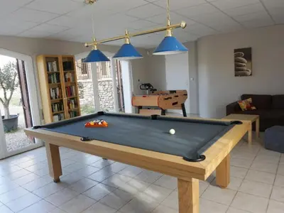 a living room with a pool table in it at La Buisse in Simiane-la-Rotonde
