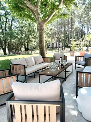 a group of chairs and tables on a patio at Villa Provençale - Rognes campagne d'Aix en Provence in Rognes