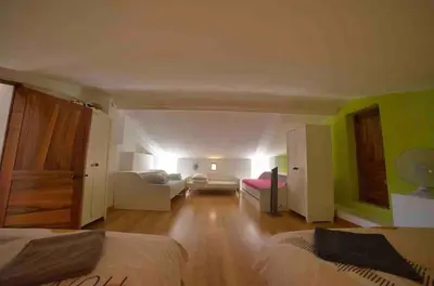 a large room with two beds and a couch at Villa Provençale - Rognes campagne d'Aix en Provence in Rognes