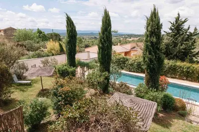 an image of a villa with a swimming pool and trees at Le Mas de Cink in Saint-Saturnin-les-Apt