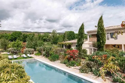 a house with a swimming pool in a yard at Le Mas de Cink in Saint-Saturnin-les-Apt