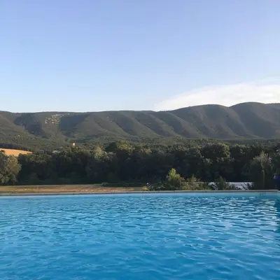 a large body of water with mountains in the background at Domaine de la Bastidonne in Céreste