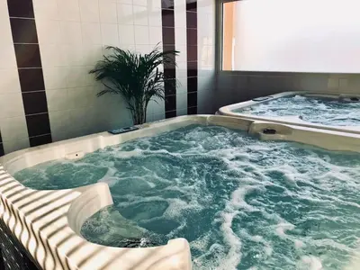 a large jacuzzi tub in a bathroom at Maison de vacances près du Mont Ventoux in Aubignan