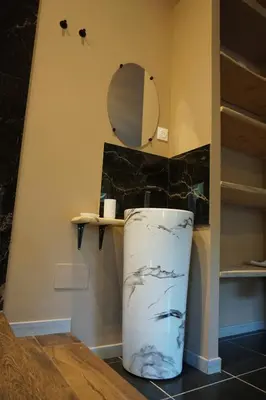 a bathroom with a sink and a mirror at Chambre de charme indépendante Alba avec baignoire îlot - Domaine Astra, Grans in Grans