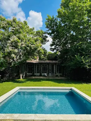 a swimming pool in front of a house at Le Poulailler, private house with garden and parking in Aix-en-Provence