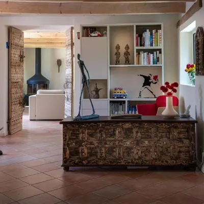 a table with chairs and a table set up for a meal at Mas familial dans les vignes, idéal télétravail in La Tour-dʼAigues